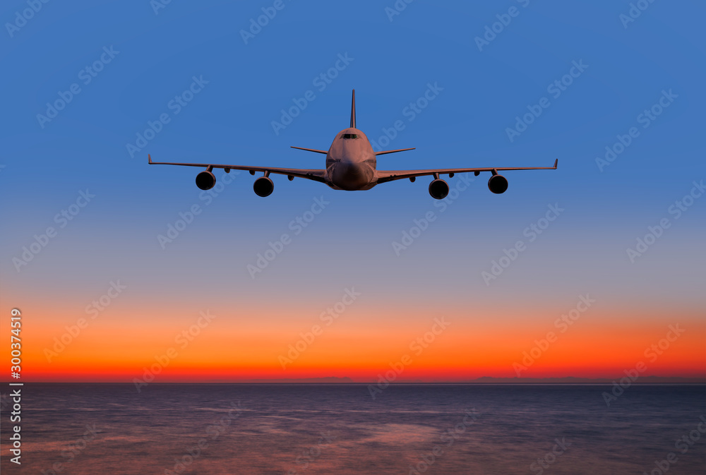 Airplane in the sky at sunset