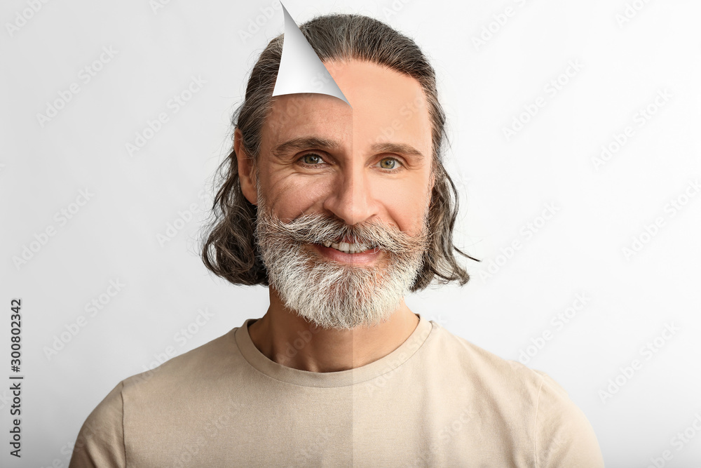 Portrait of mature man on white background