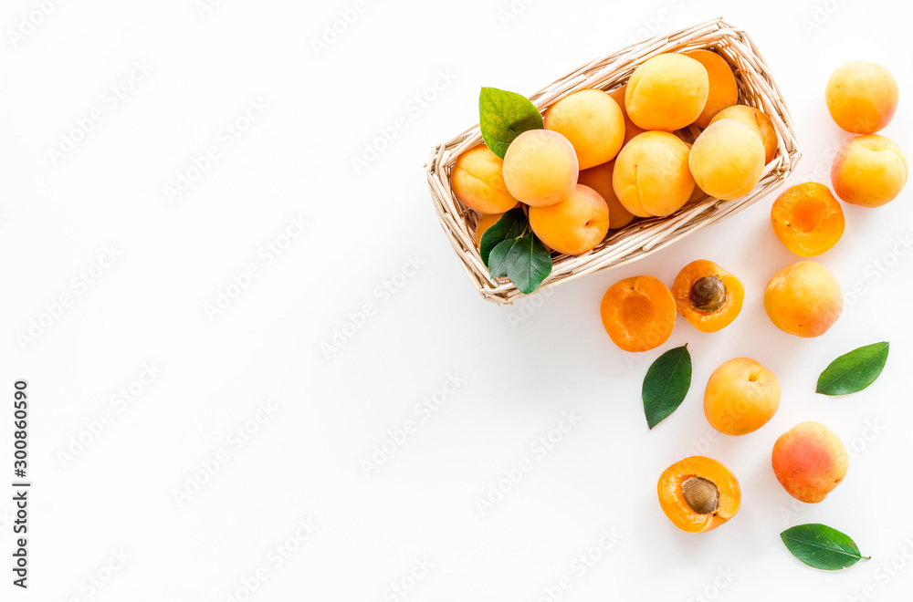 Collect apricots, white background top view copy space, pattern with leaves