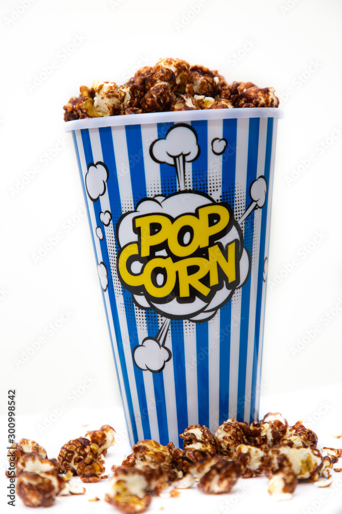  popcorn in a popcorn cup on white background