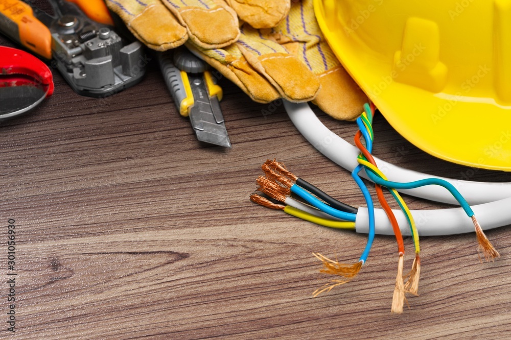 Yellow hard hat and leather work gloves