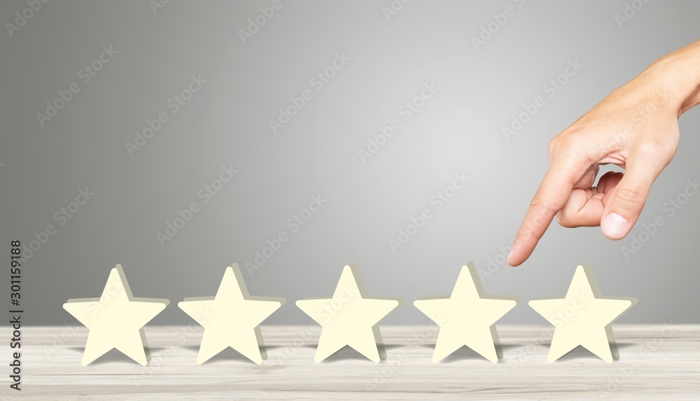 Customer satisfaction concept, survey of quality feedback, hand touching five stars