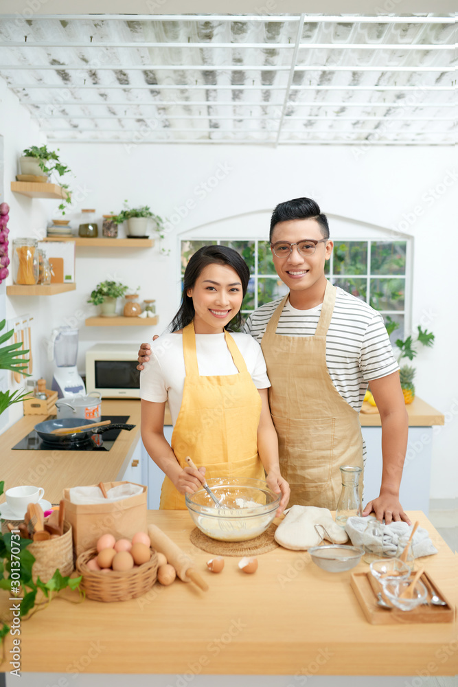 Couple cooking together at home