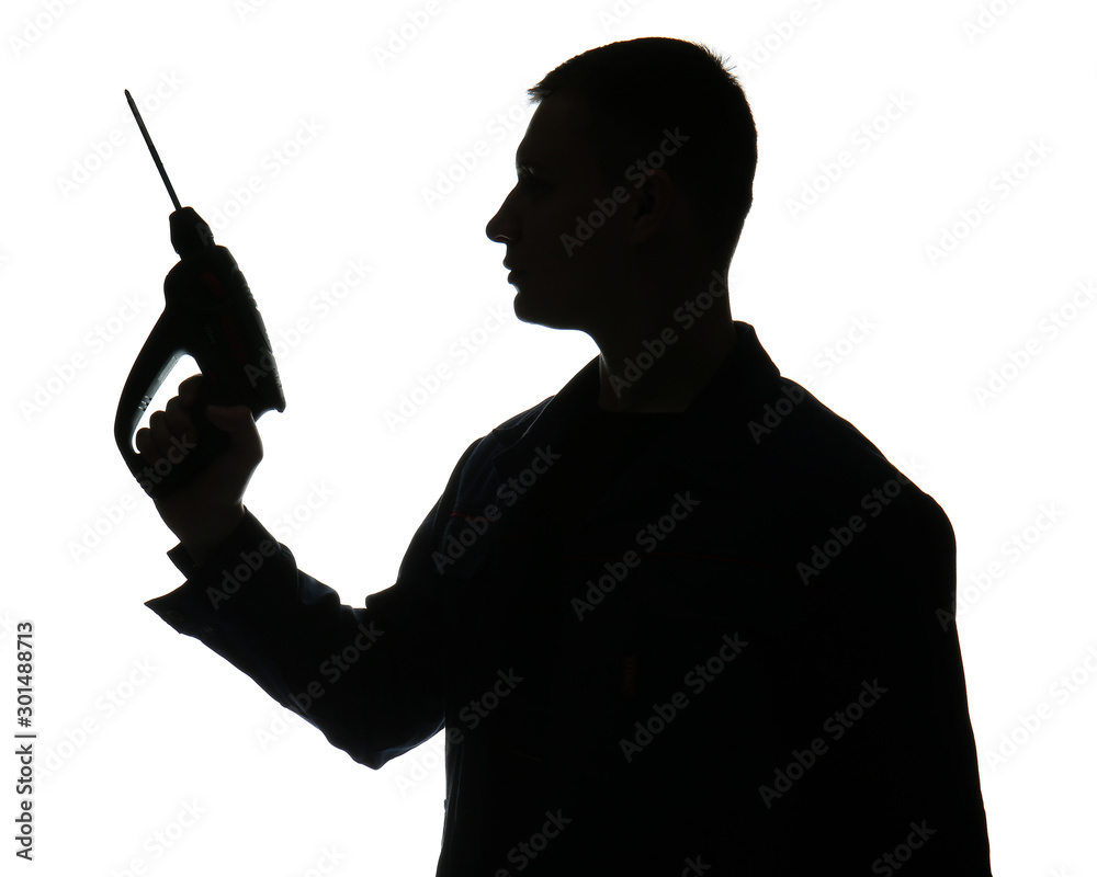 Silhouette of male worker with drill on white background