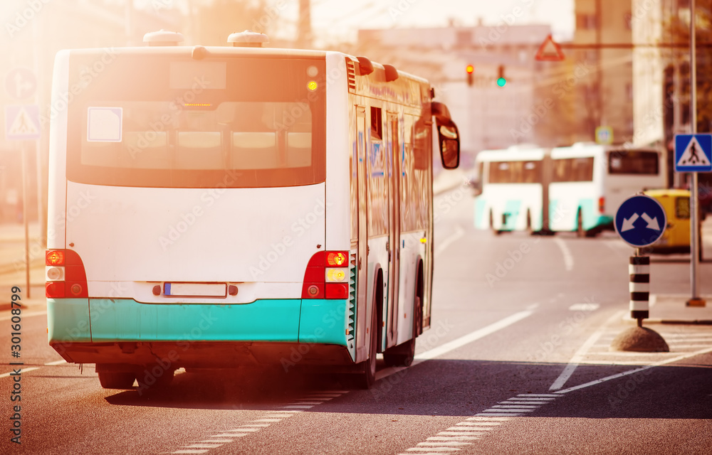 Bus moving on the road in city in early morning