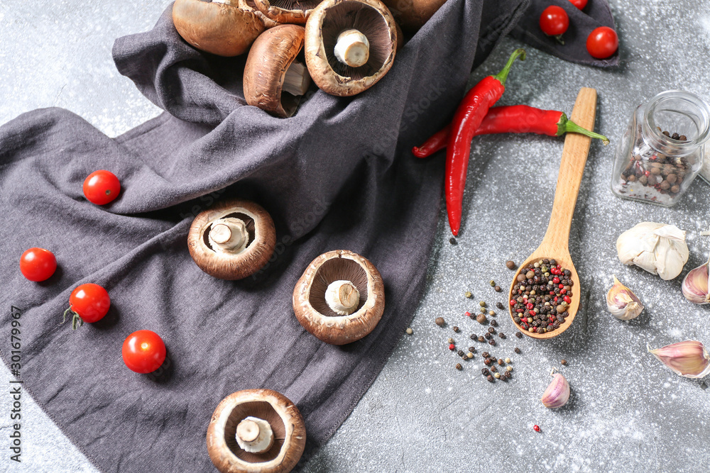 Composition with fresh champignon mushrooms and spices on table