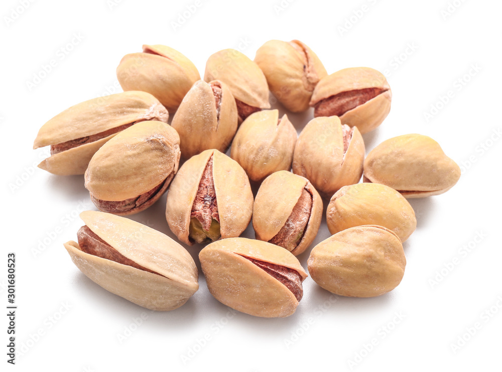 Tasty pistachio nuts isolated on white