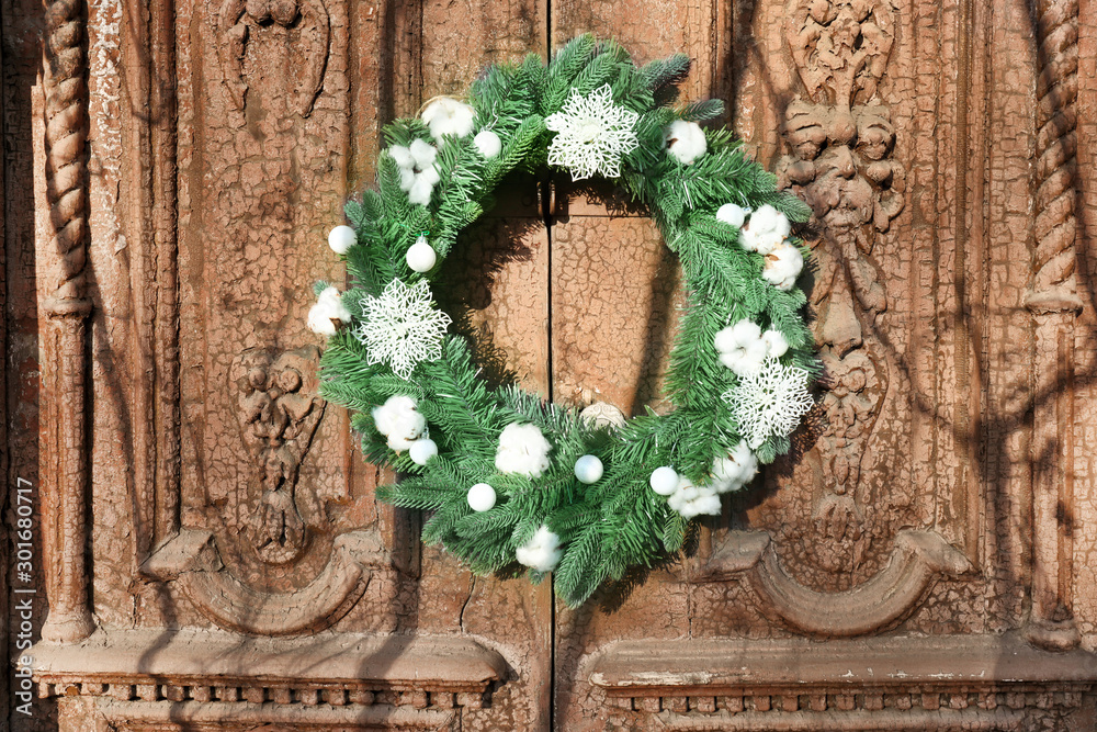 Beautiful Christmas wreath hanging on door