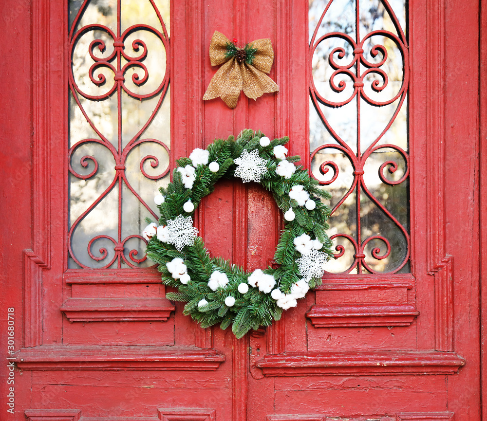 Beautiful Christmas wreath hanging on door