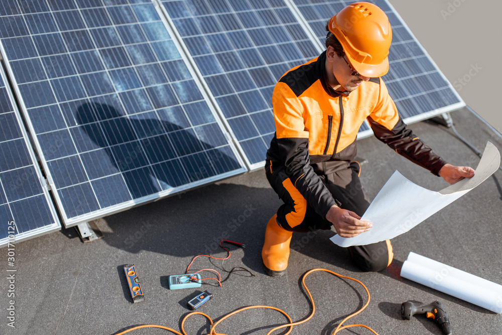 Electrician installing solar panels