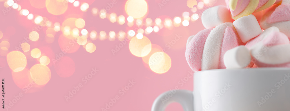 Marshmallow. Close-up of Marshmallows colorful chewy candy, over pink bokeh background, closeup. Swe