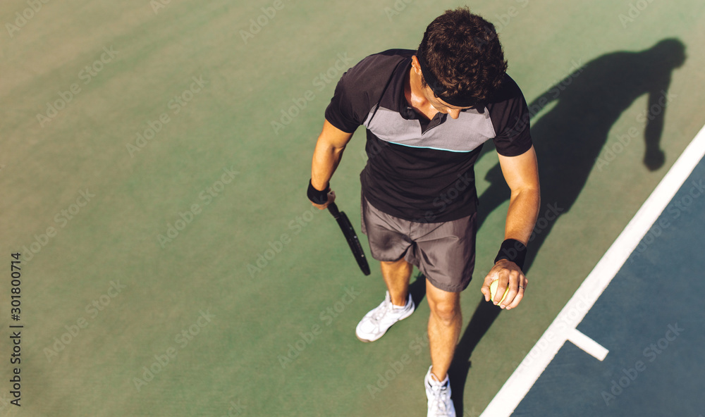 Player about to serve in a tennis game