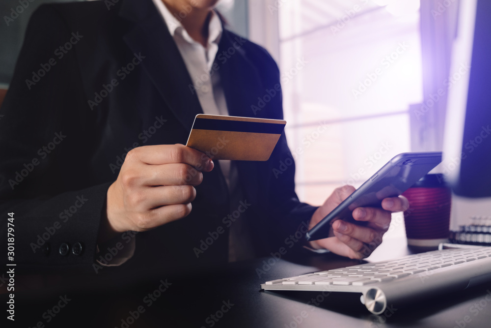 businessman hand using smart phone, tablet payments and holding credit card online shopping, omni ch