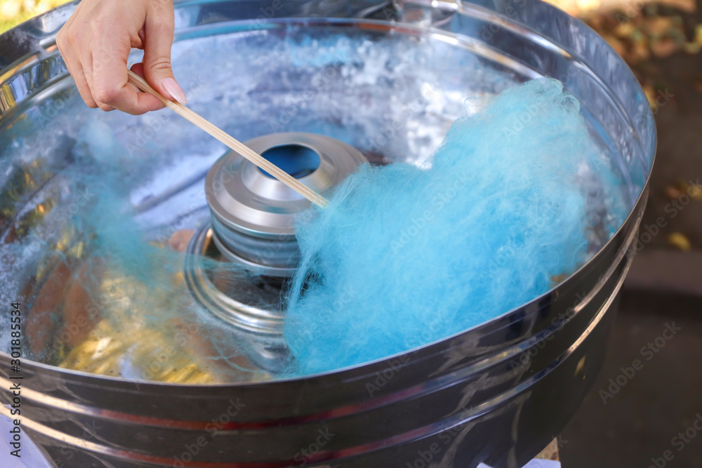 Making of sweet cotton candy outdoors, closeup