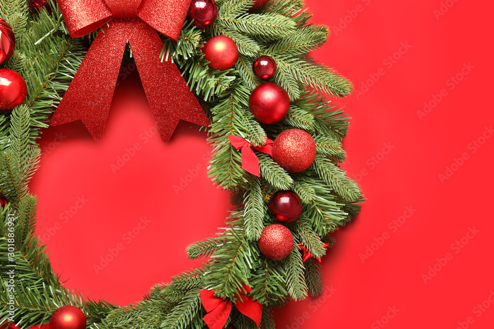 Beautiful Christmas wreath on color background