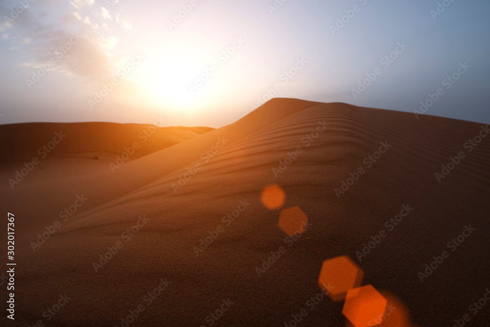 The beauty of the sand dunes in the Sahara Desert in Morocco. The Sahara Desert is the largest hot d