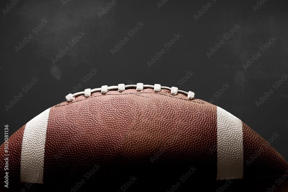 American football ball on background