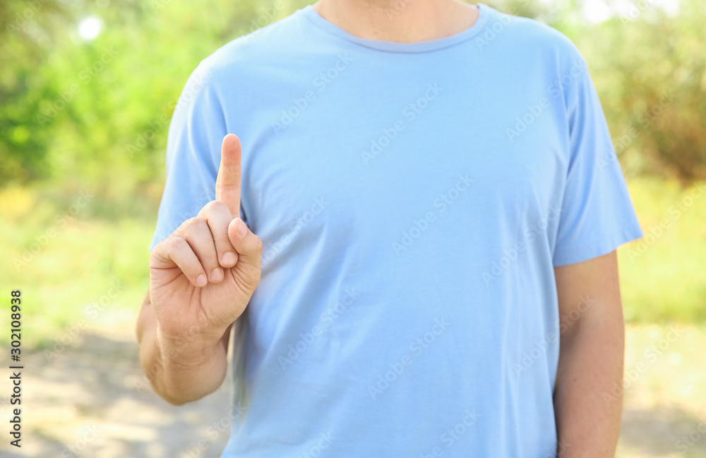 Man using virtual screen outdoors