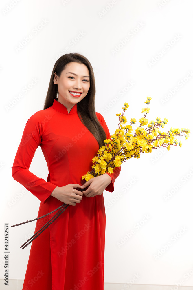 Vietnamese woman holding flower means happy new year