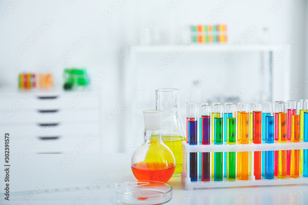 Glassware with colorful samples in laboratory