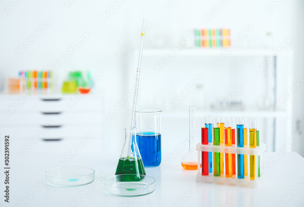 Glassware with colorful samples in laboratory