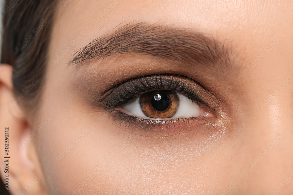 Young woman with beautiful eyebrows, closeup