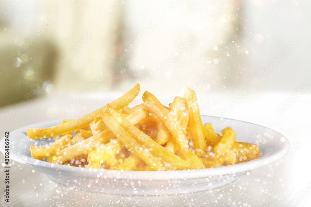 French fries in a red carton box isolated on white