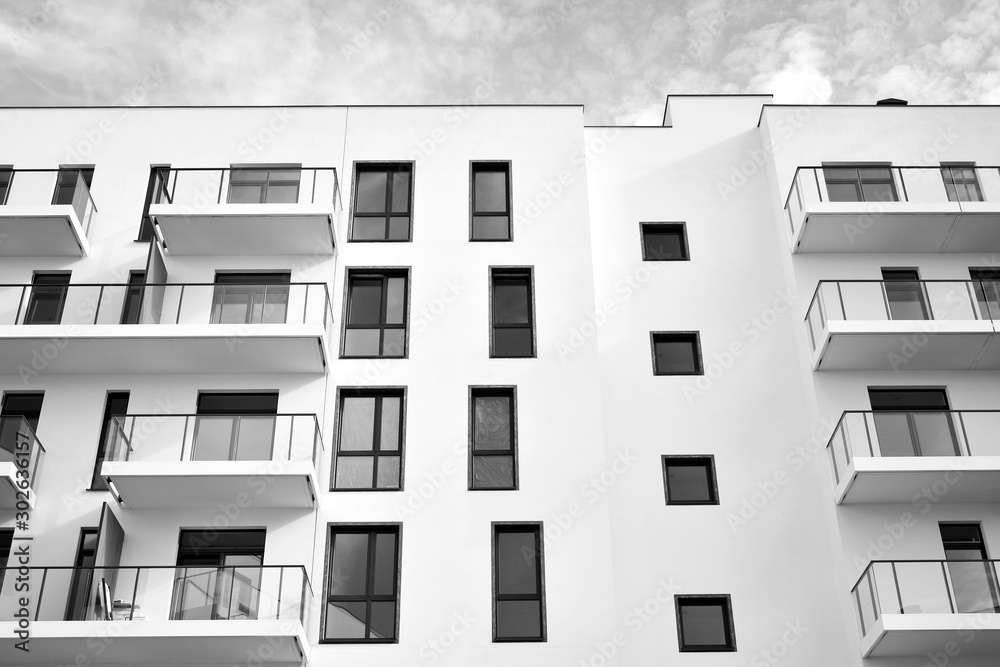 Contemporary apartment building. Generic residential architecture. Black and white.