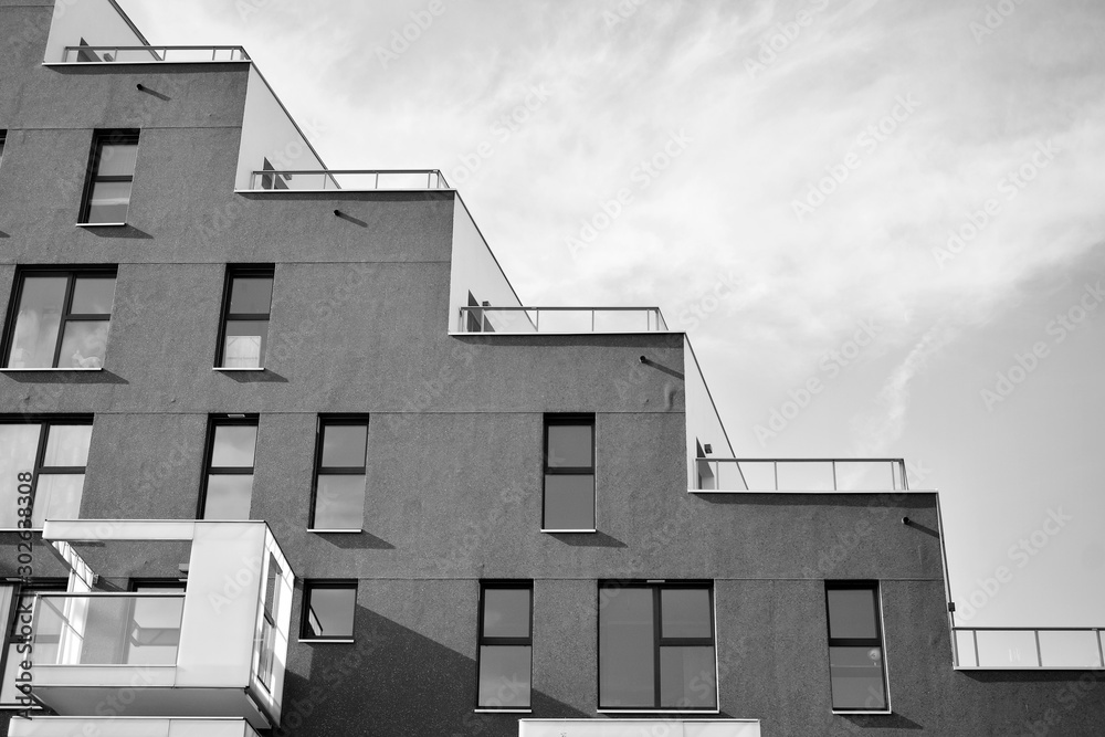 Contemporary apartment building. Generic residential architecture. Black and white.