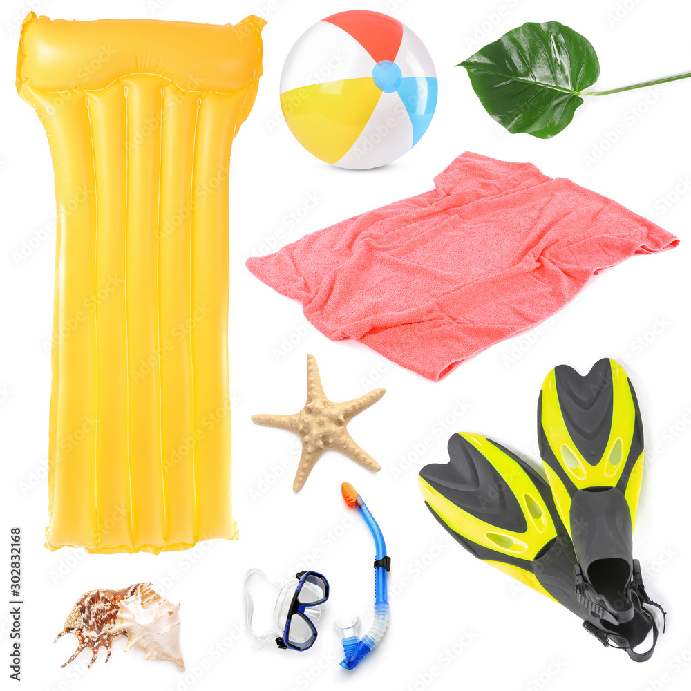 Set of beach accessories on white background