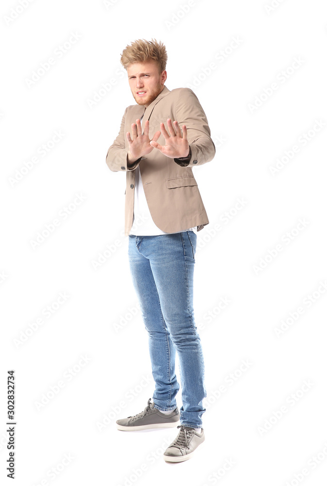 Portrait of afraid man on white background