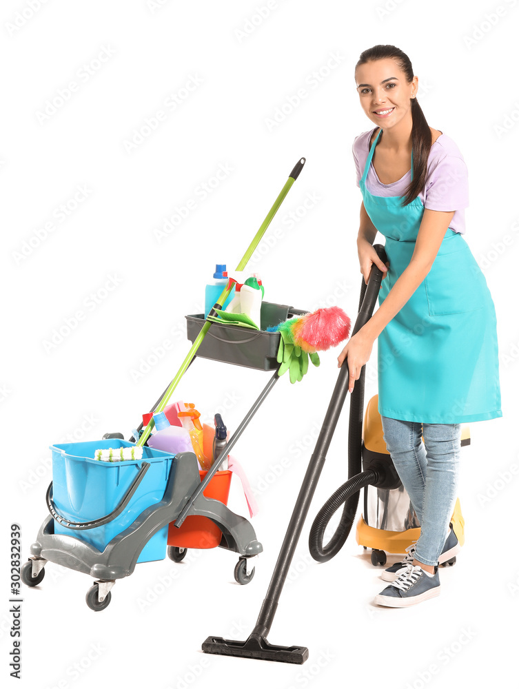 Female janitor with cleaning supplies on white background