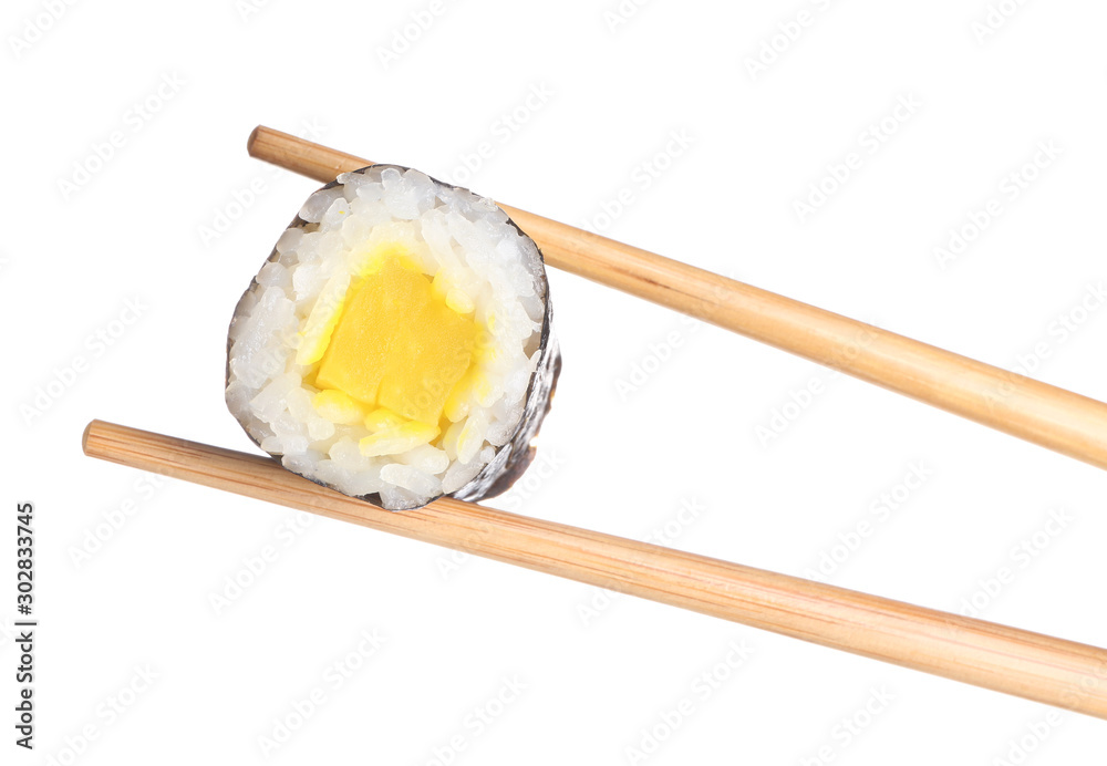 Chopsticks with tasty sushi roll on white background