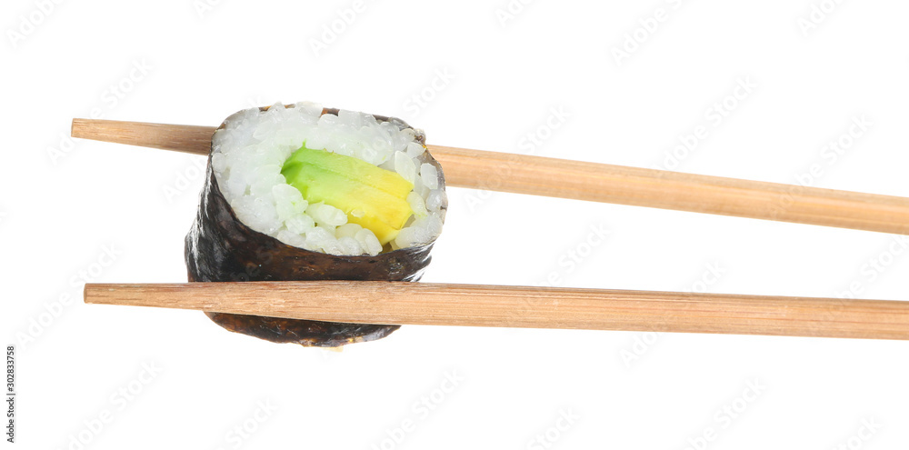 Chopsticks with tasty sushi roll on white background