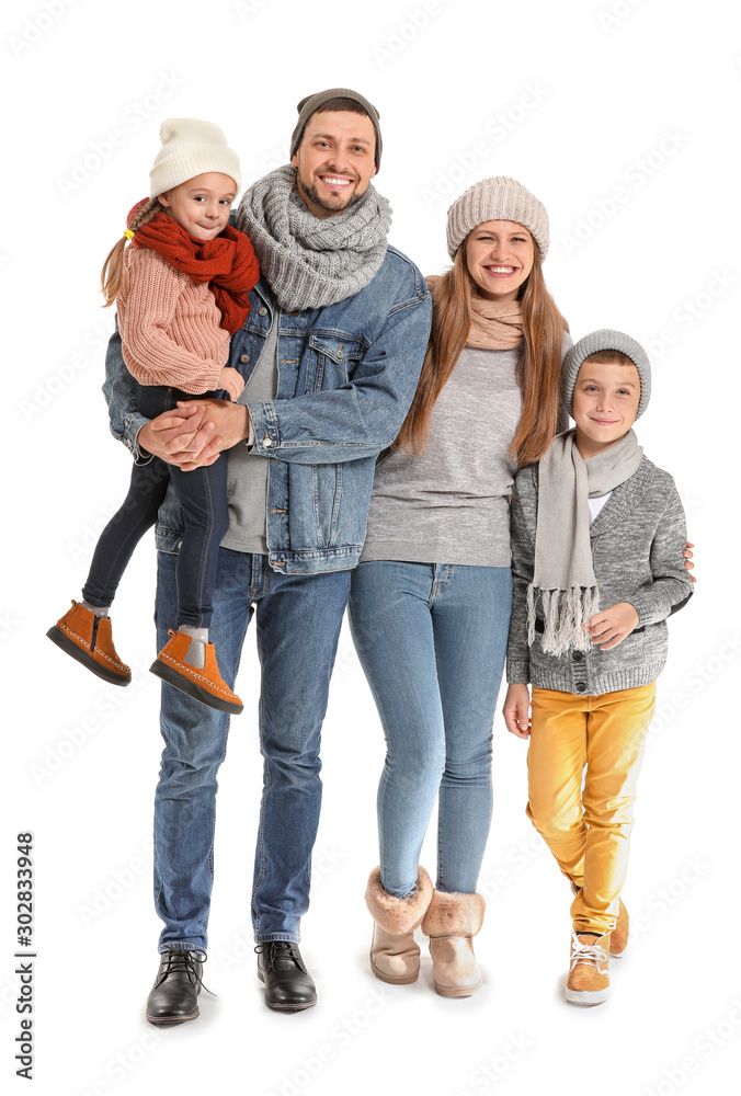 Portrait of happy family in autumn clothes on white background