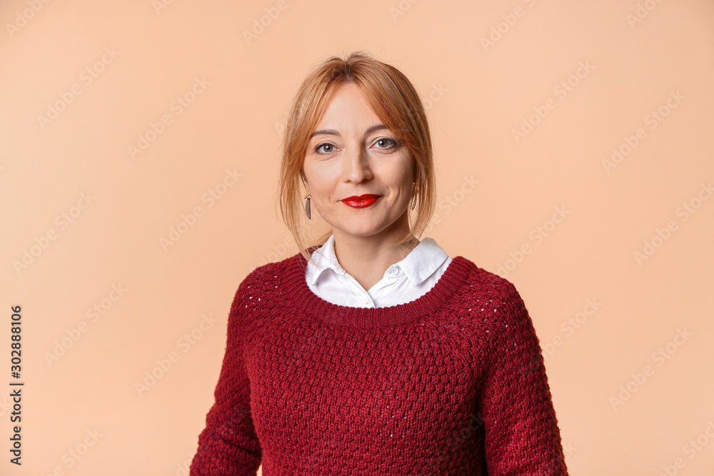 Stylish mature woman on color background