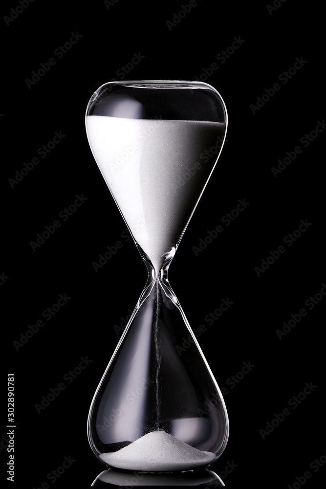 Crystal hourglass on dark background