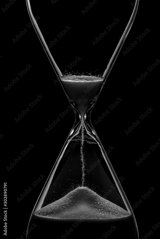 Crystal hourglass on dark background