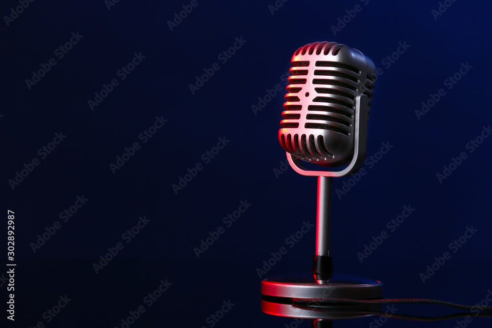 Retro microphone on dark color background