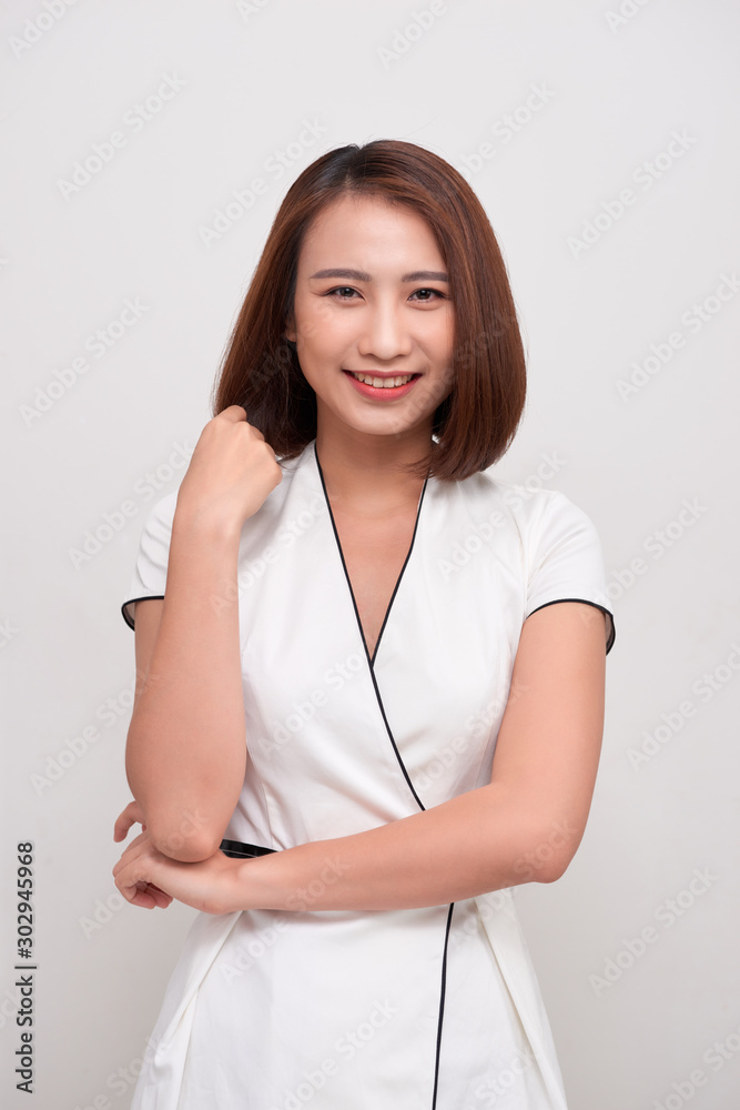 Smiling asian business woman on white background