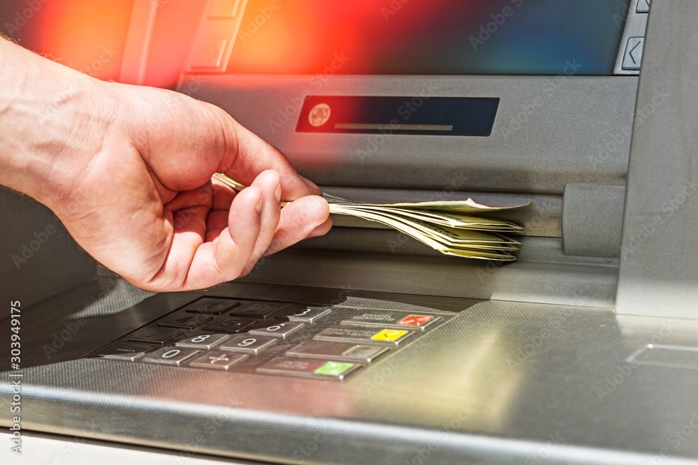 Atm bank banking paper currency bank teller removing currency