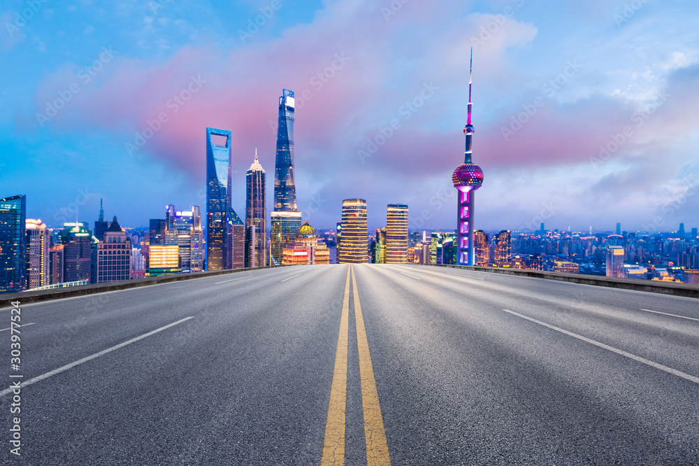 Asphalt highway and beautiful cityscape in Shanghai at night.