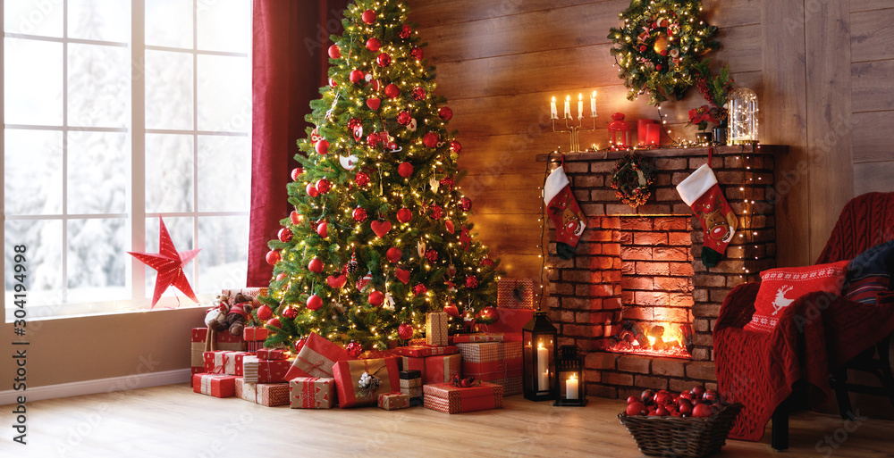 interior christmas. magic glowing tree, fireplace, gifts