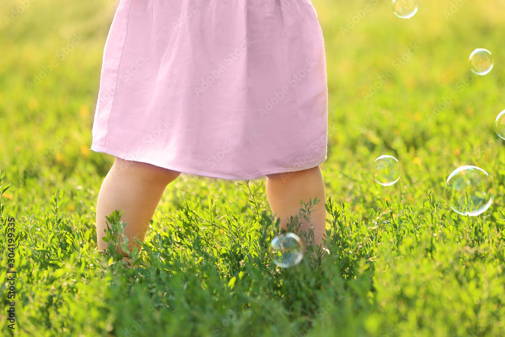 Cute little baby outdoors on summer day, closeup