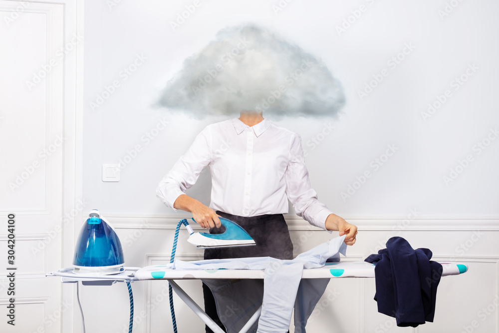 Woman ironing dress shirt with head of vapor cloud