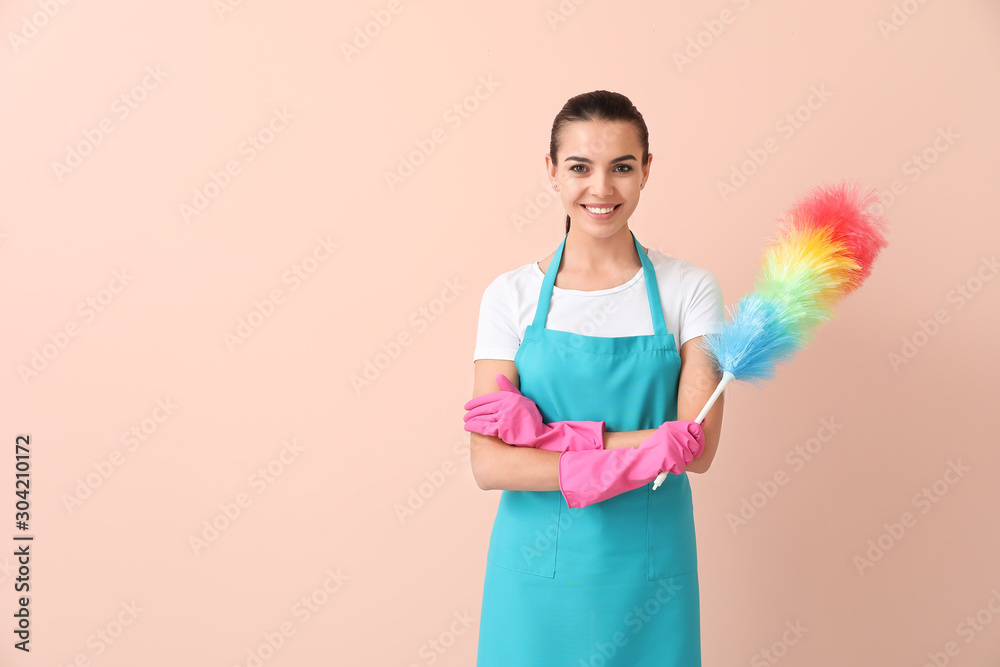 Female janitor on color background