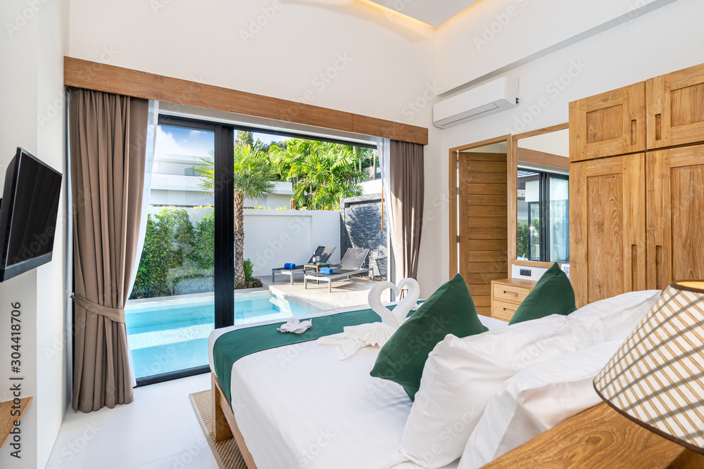 Pool view from spacious bedroom in a luxury house