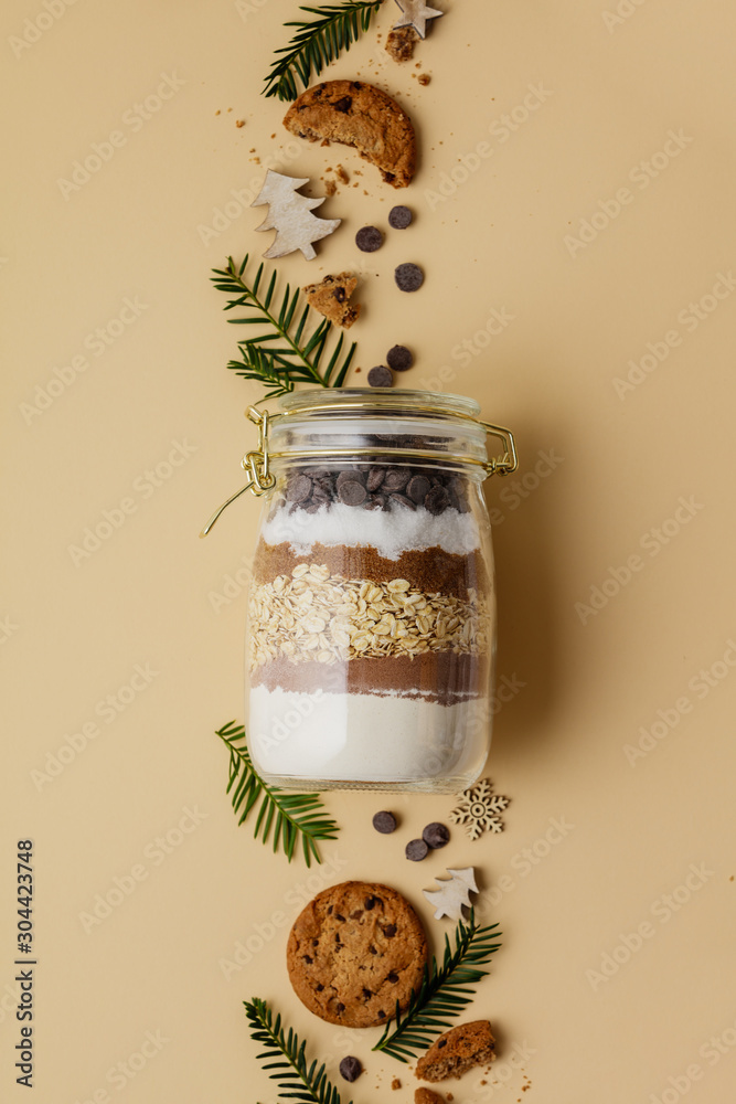 Chocolate chips cookie mix in glass jar for Christmas gift