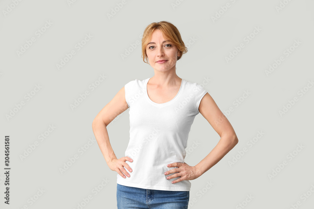 Beautiful mature woman on light background