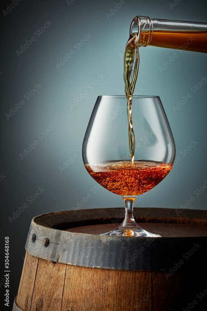 cognac pouring into glass